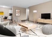 Thumbnail 5 of 34 - A modern living room with a grey and white patterned ball on the carpet.
