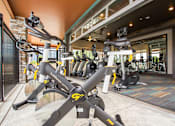 Thumbnail 26 of 42 - Cycling machines on Fitness Center patio, garage door opens space up