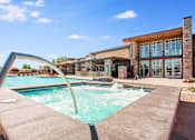 Thumbnail 17 of 42 - Outdoor hot tub next to outdoor pool, with long curved railing