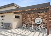 Thumbnail 29 of 42 - a building with three bikes parked outside of it