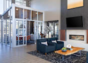 Thumbnail 35 of 42 - A modern living room with a fireplace and a flat screen TV.