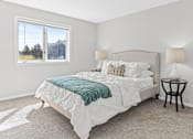 Thumbnail 6 of 29 - a bedroom with a bed and a window