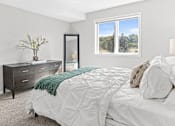 Thumbnail 9 of 29 - a bedroom with a bed and a window