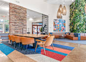 Thumbnail 12 of 29 - a conference room with a table and chairs and a green wall