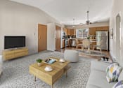 Thumbnail 5 of 11 - a living room with a couch and a table