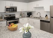 Thumbnail 7 of 20 - a kitchen with granite counter tops and stainless steel appliances
