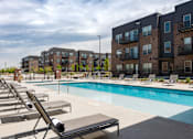 Thumbnail 35 of 40 - Outdoor pool with sun loungers 