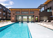 Thumbnail 34 of 40 - A resort style outdoor swimming pool