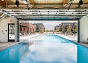Thumbnail 3 of 40 - A resort-style indoor and outdoor pool