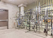 Thumbnail 39 of 40 - a rack of bikes in a building with a door