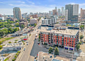 Thumbnail 37 of 40 - an aerial view of a city street with a red building