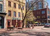 Thumbnail 34 of 40 - Street view of surrounding dining and shopping options in the Minneapolis area. One building sign reads