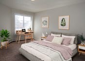 Thumbnail 7 of 28 - Spacious bedroom with a large window letting in natural light.