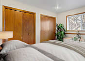 Thumbnail 5 of 17 - a bedroom with a bed and a window and a closet