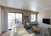 Thumbnail 8 of 17 - Furnished Living Room with Couch, TV and Sliding Glass Door