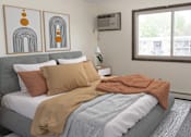 Thumbnail 7 of 23 - a bedroom with a bed and a window