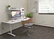 Thumbnail 8 of 23 - an office with a white desk and chair and a computer