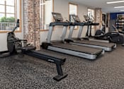 Thumbnail 9 of 23 - RiverPointeApartmentsFridleyMN-Fitness Center Cardio