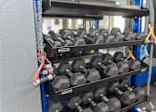 Thumbnail 10 of 23 - RiverPointeApartmentsFridleyMN-Fitness Center Strength Equipment2