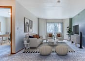 Thumbnail 3 of 20 - a living room with a couch and a table