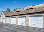 Thumbnail 19 of 20 - a row of garage doors on the side of a building