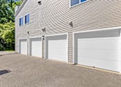 Thumbnail 33 of 34 - A building with four garage doors in front.