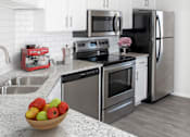 Thumbnail 2 of 29 - Kitchen with White Cabinets and Granite Countertops