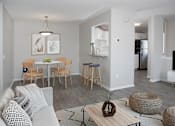 Thumbnail 5 of 29 - Dining Room with Table and Living Room with Sofa