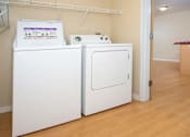 Thumbnail 7 of 12 - In unit washer and dryer side by side with shelf storage above.