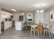 Thumbnail 7 of 28 - Kitchen connected to living room with circular dining table