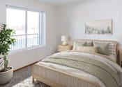 Thumbnail 3 of 34 - a bedroom with a bed and a window