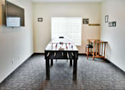 Thumbnail 9 of 15 - Game Room with FoosHockey Table and TV