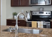 Thumbnail 3 of 15 - Sink on Center Island with Granite Counter Tops