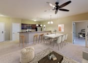Thumbnail 2 of 9 - Full Kitchen with Breakfast Bar and Open Dining Room with Dining Table