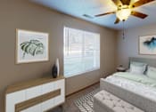 Thumbnail 10 of 12 - Spacious bedroom with a large window letting in natural light.