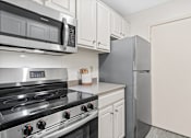 Thumbnail 1 of 31 - Kitchen with appliances at The Bosk Apartment Homes, Woodbury