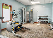 Thumbnail 14 of 29 - A gym room with a row of treadmills and exercise equipment.