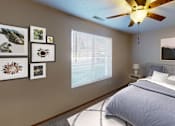 Thumbnail 6 of 12 - Furnished bedroom with queen bed, ceiling fan and large window for natural light
