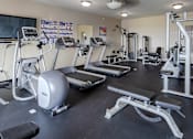 Thumbnail 6 of 9 - a room filled with lots of different types of exercise equipment