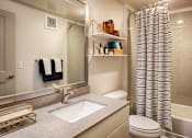 Thumbnail 11 of 24 - Bathroom with Granite Counters, Toilet and Shower