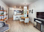 Thumbnail 7 of 24 - Open Dining and Living Room with Table and TV