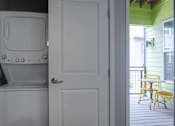 Thumbnail 10 of 29 - In unit stacked washer dryer in closet near balcony door.