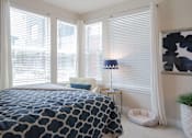 Thumbnail 8 of 29 - Bright bedroom with 4 windows letting in ample natural light.