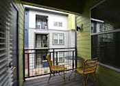 Thumbnail 11 of 29 - Private patio access from your apartment with black iron railing.