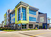 Thumbnail 2 of 29 - Exterior of Westend Apartments. Building features large windows and lime detailing on the front corner.