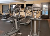 Thumbnail 17 of 24 - WoodhavenApartmentsMinneapolisMNStateOfTheArtHealthClubFitnessCenterWithGreatEquipmentOptions1