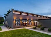 Thumbnail 3 of 28 - a modern house with a garage and a lawn at The Bosk Apartment Homes, Woodbury, MN
