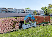 Thumbnail 23 of 28 - A sign for Dog Park with a dog on it at The Bosk Apartment Homes, Minnesota 55125
