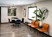 Thumbnail 6 of 32 - a dining room with a table and chairs and a potted plant at La Bella Apartments, Fort Worth, 76116