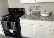 Thumbnail 2 of 32 - Small Kitchen at La Bella Apartments, Fort Worth, 76116